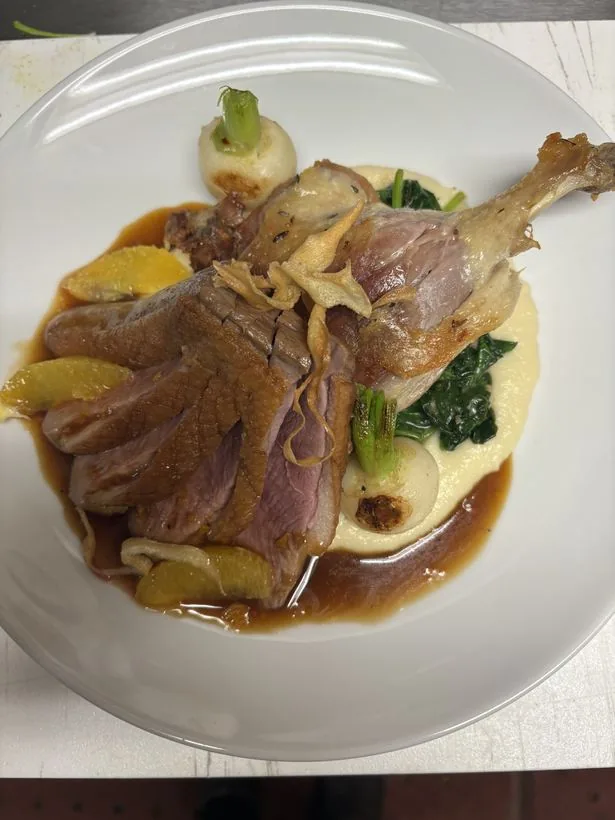 Duck leg with purée spinach citrus jus