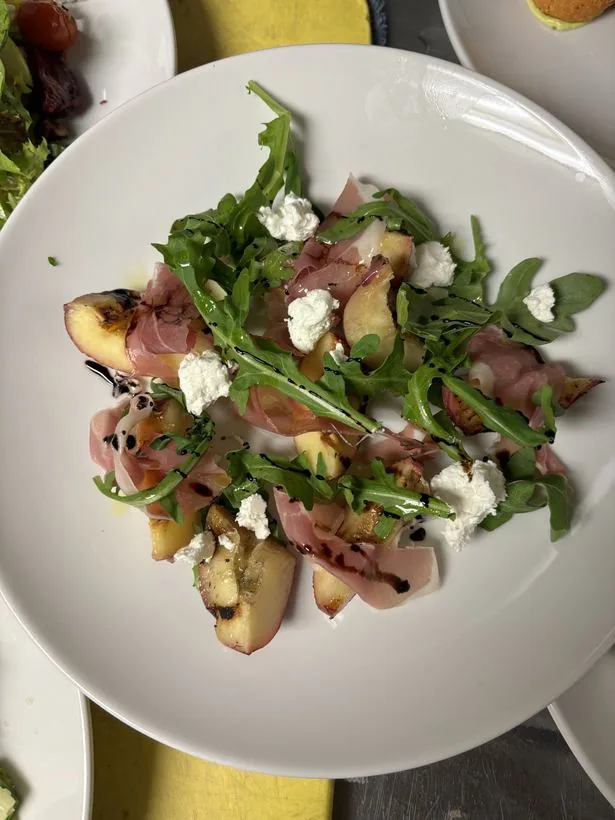 Grilled peach prosciutto arugula salad