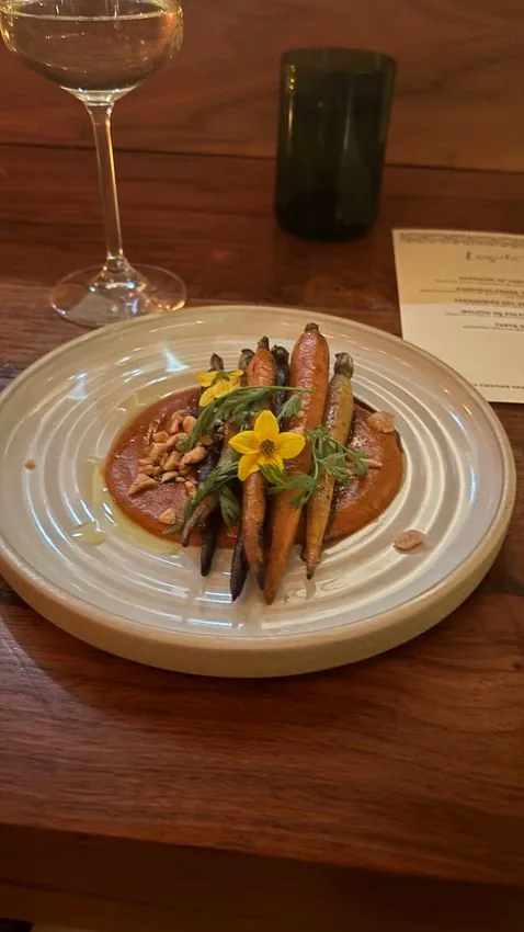 Roasted rainbow carrots on romesco